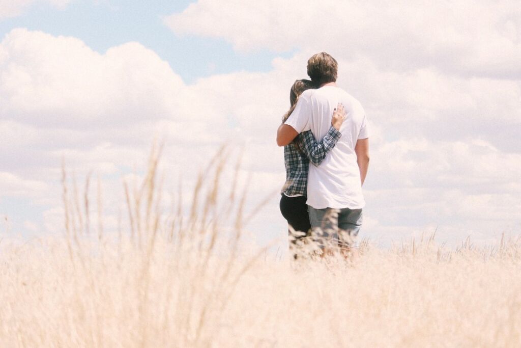 Two people hugging as they go through and understand different relationship stages.