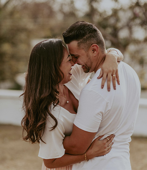 Happy couple hugging in an intimate moment, represent how the support of expert relationship therapists can help strengthen your relationship.
