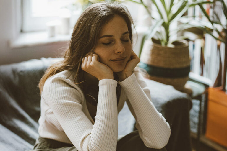 Woman looking calm and at peace, representes how Anxiety Therapy in Orange County can help you find balance.
