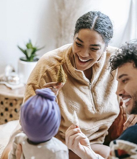 Happy family smiling together, represents how a depression counselor can help strenghen your relationships.